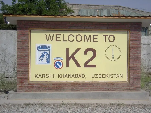 The entrance sign of the Karshi-Khanabad air base — “Camp Stronghold Freedom” (photograph from 2003). Photo: U.S. Air Force. Licence: public domain. Source: Wikimedia Commons https://commons.wikimedia.org/wiki/File:Welcome_To_K2_Sign.JPG